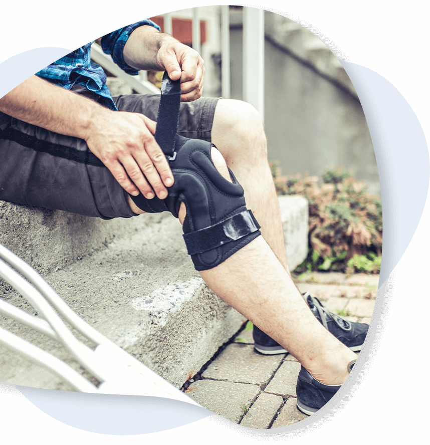 man wearing brace for knee pain