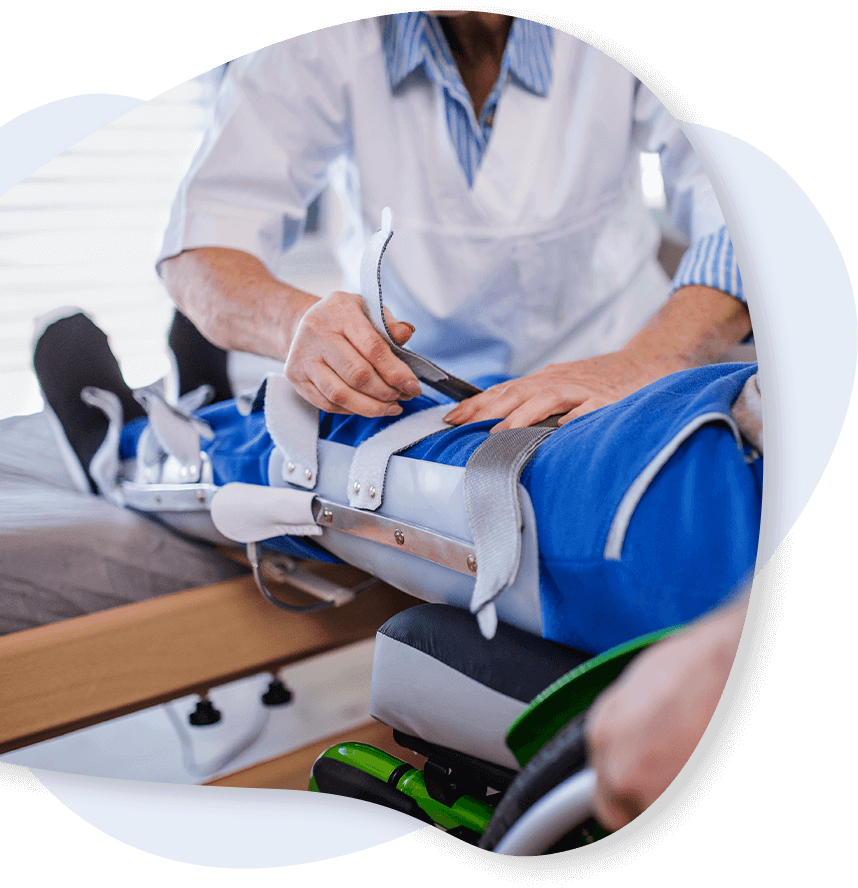orthopedic doctor helping patient with leg injury
