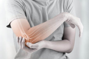 woman suffering with Tendonitis