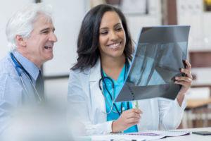 Doctors checking patient X-ray