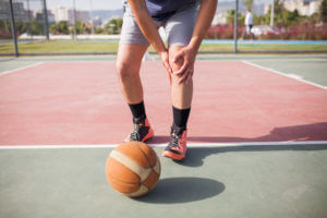 Sportsman suffering meniscus tear