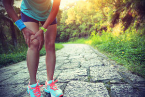 Woman suffering with knee pain