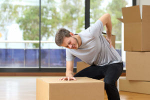 Man feeling back pain at work