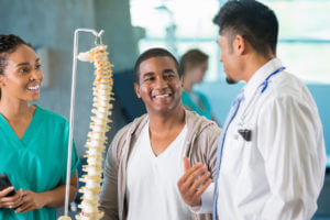 Man talking to his orthopedic doctor and nurse