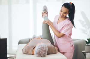 A older woman getting physical therapy