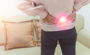 woman suffering with lumber pain
