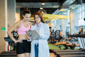 sports Medicine provider shows instructions to athlete