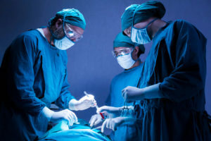 orthopedic surgeons operating surgery a patient in the operating room