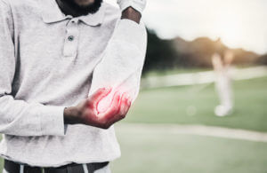 A sports person with Golfer's elbow pain.